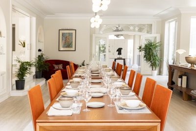 A dining room is prepared for a formal dinner.