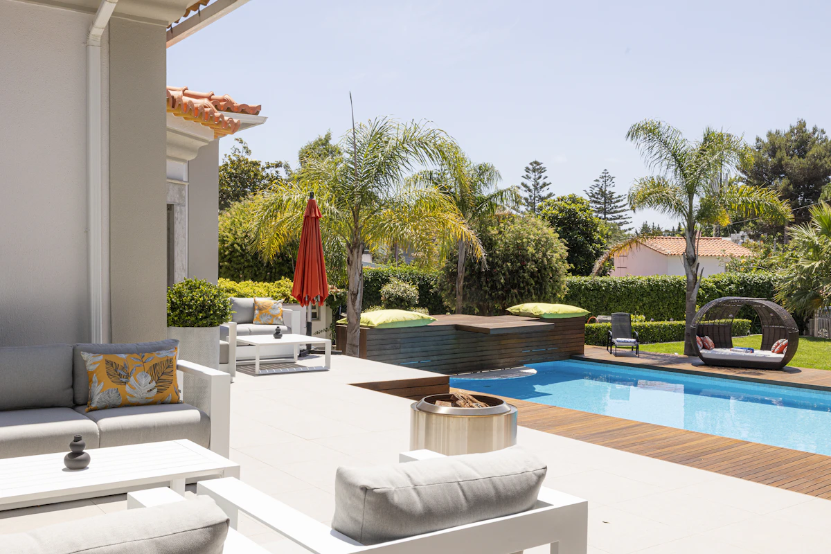 High-end backyard patio with pool on a sunny day
