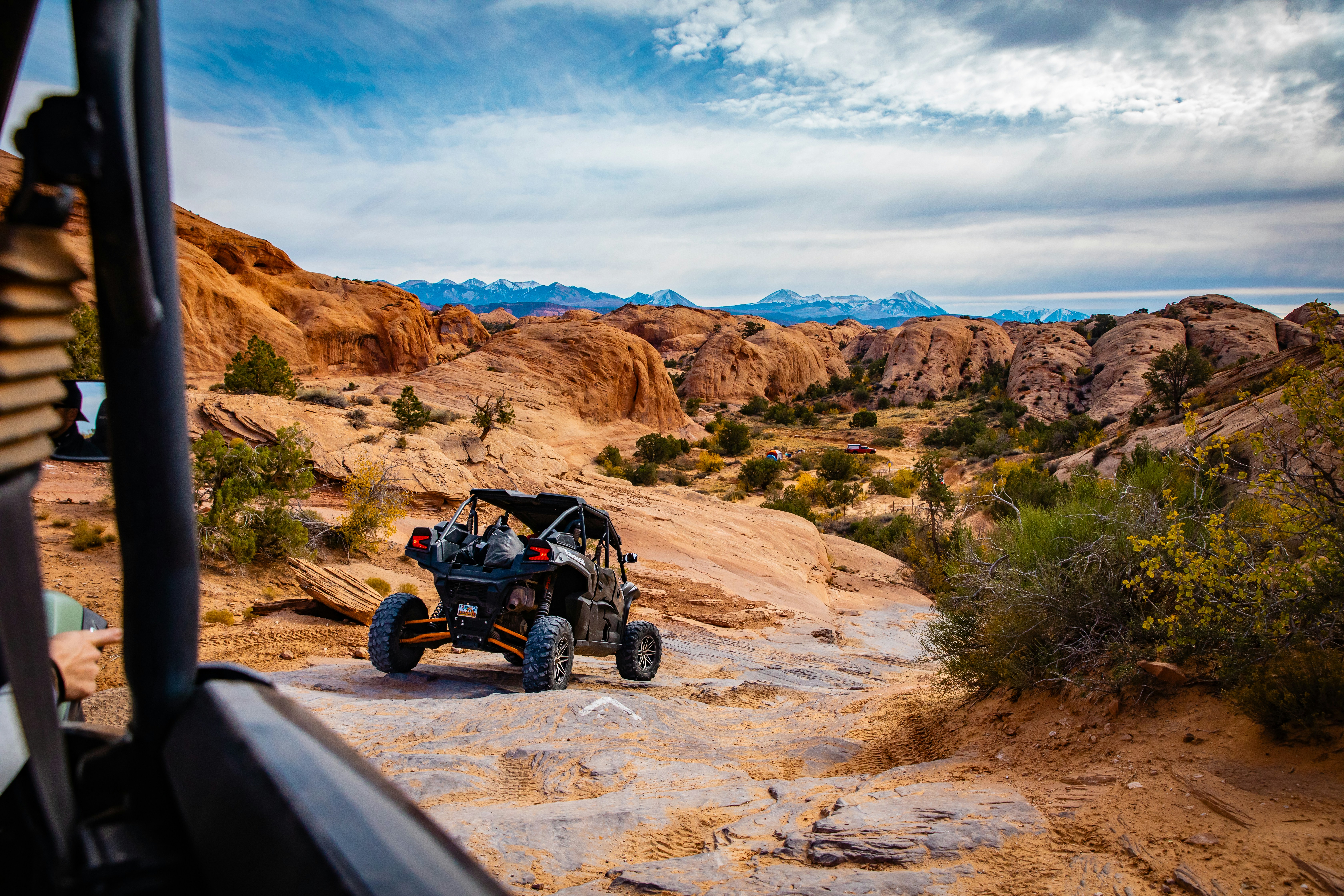 Off-roading through a rocky desert landscape.