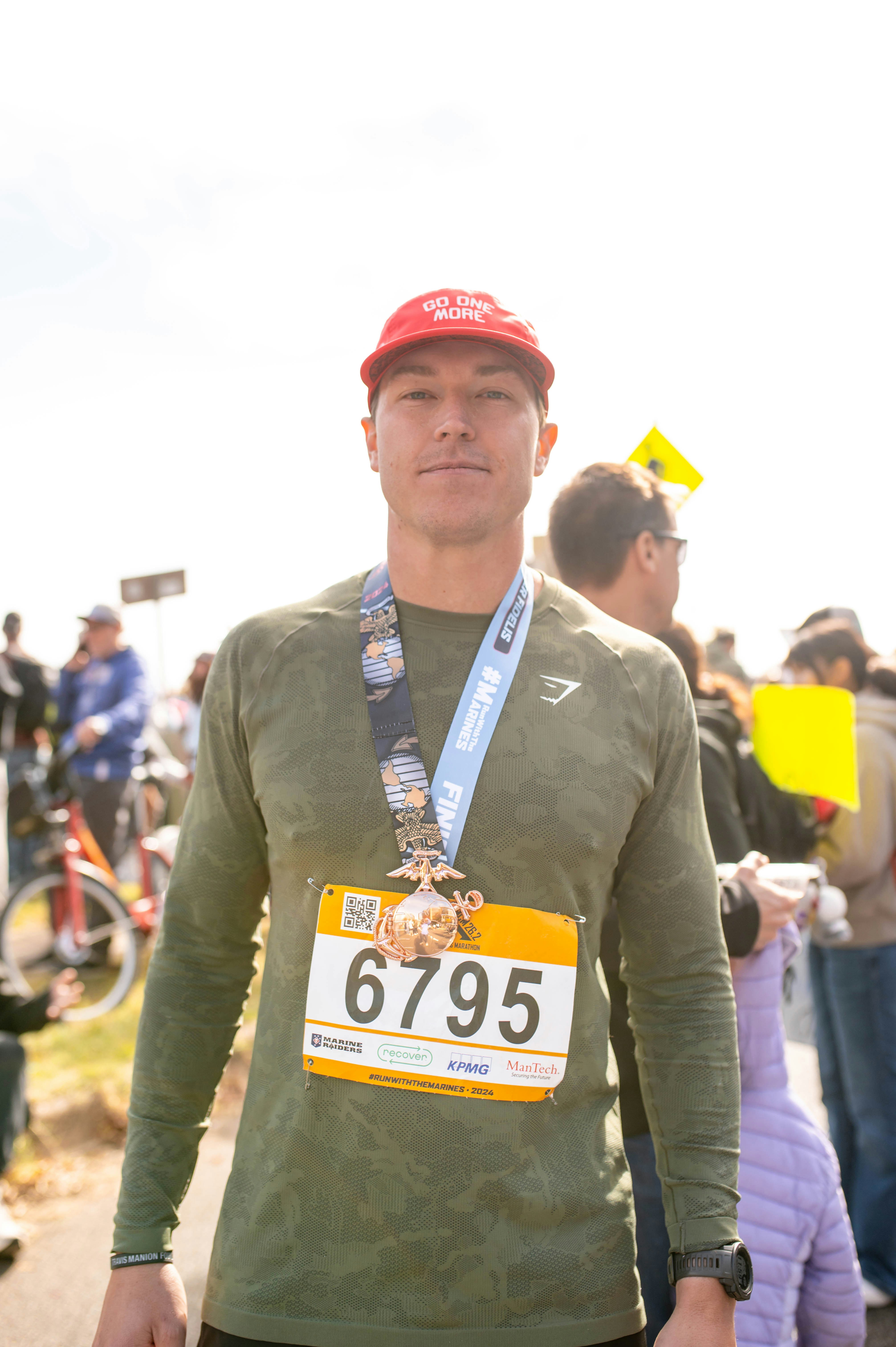 Marathoner celebrates with a medal after a race.