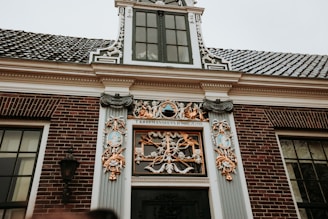 An ornate dutch building facade with detailed architectural elements.