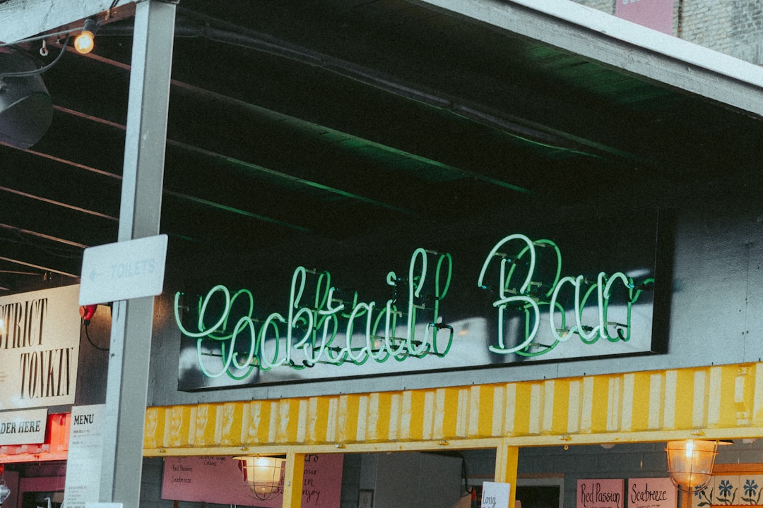 A neon sign lights up the words