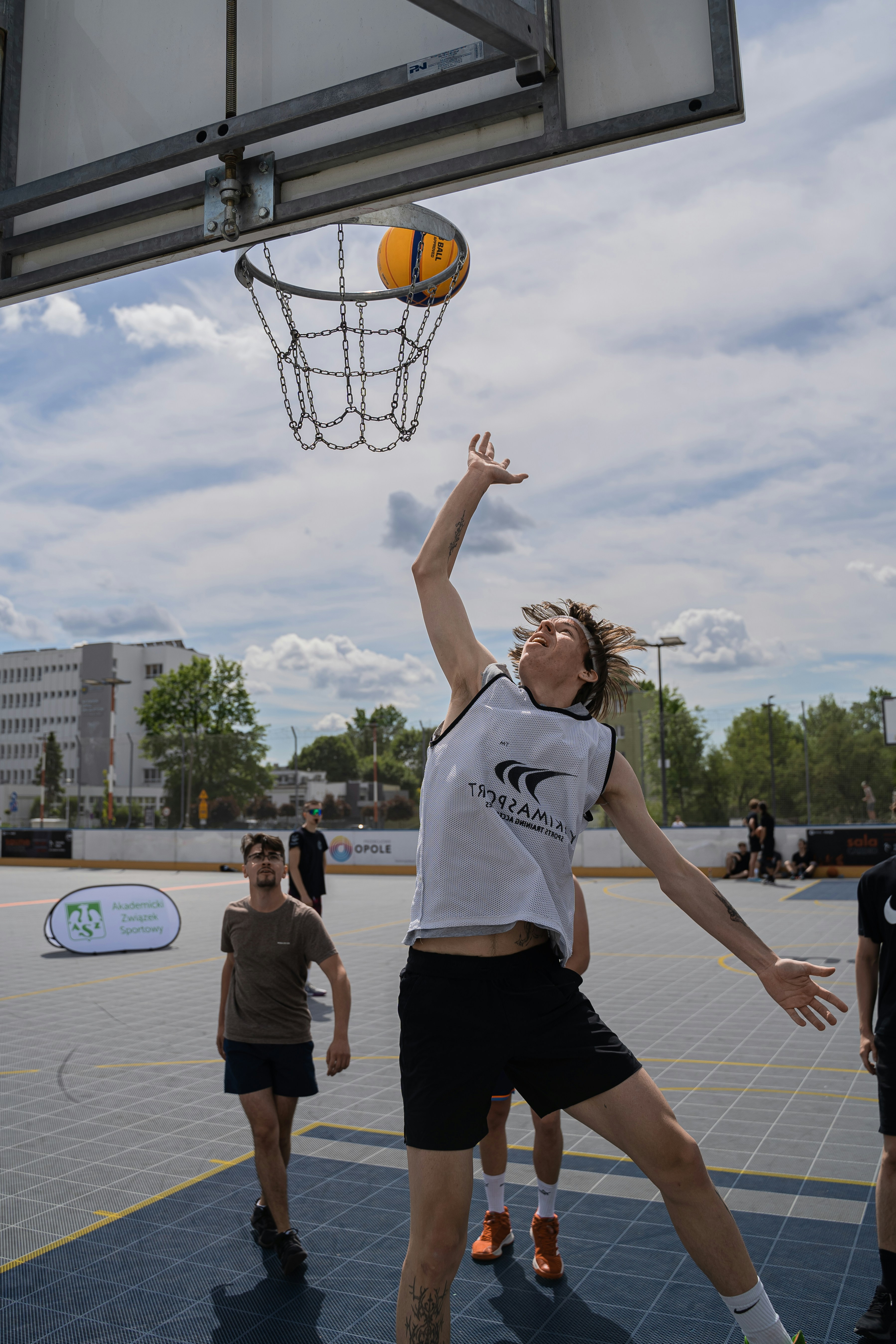 A basketball player is about to shoot the ball.