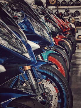 Motorcycles lined up in a showroom.