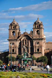 A magnificent church stands in a lively plaza.
