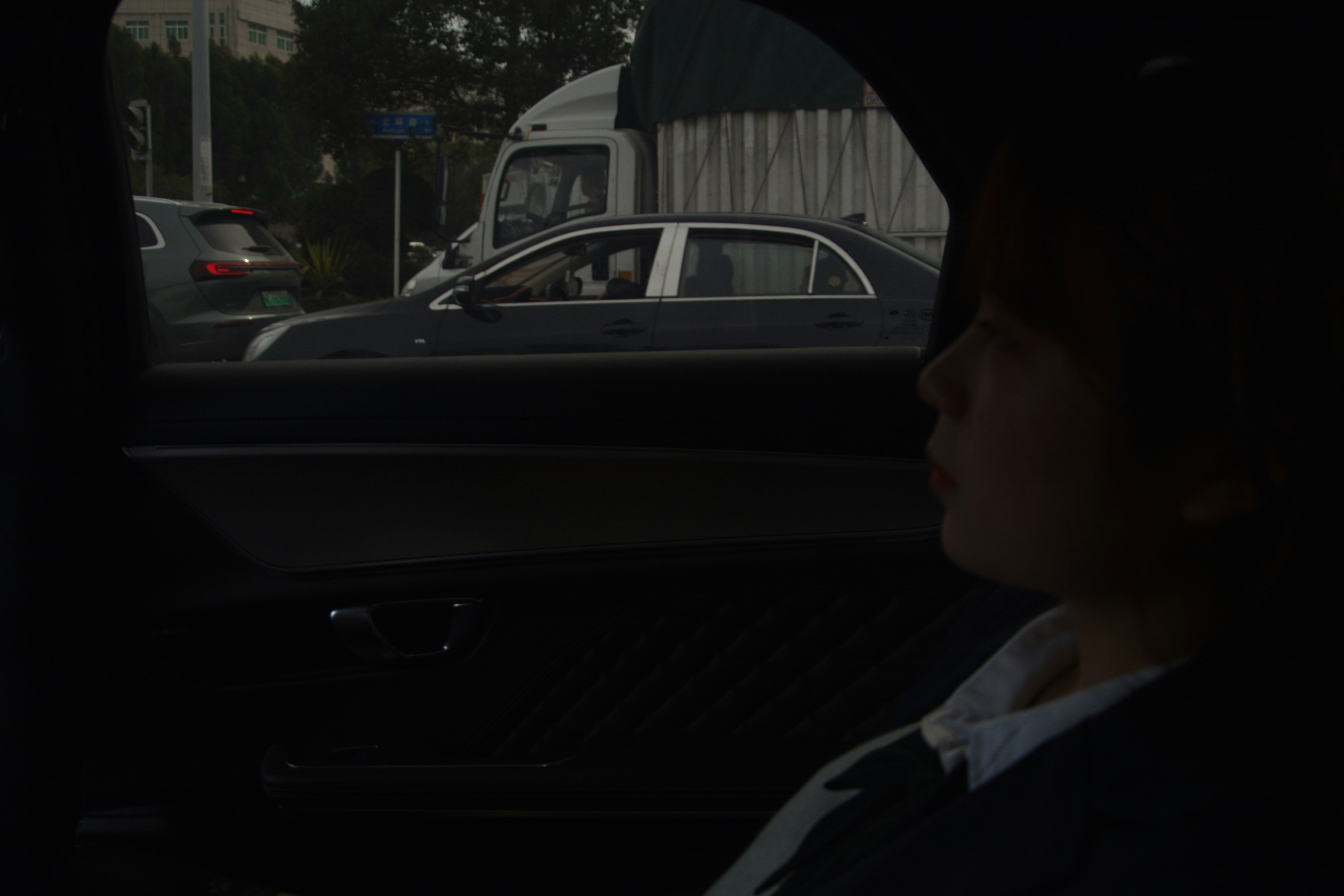 Looking outside a car window at traffic