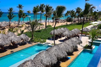 Tropical resort with pools and ocean view.
