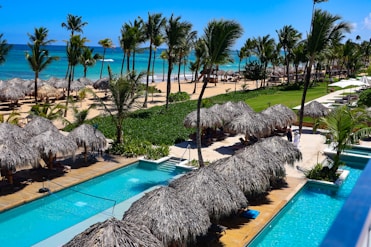 Tropical resort with pools and ocean view.
