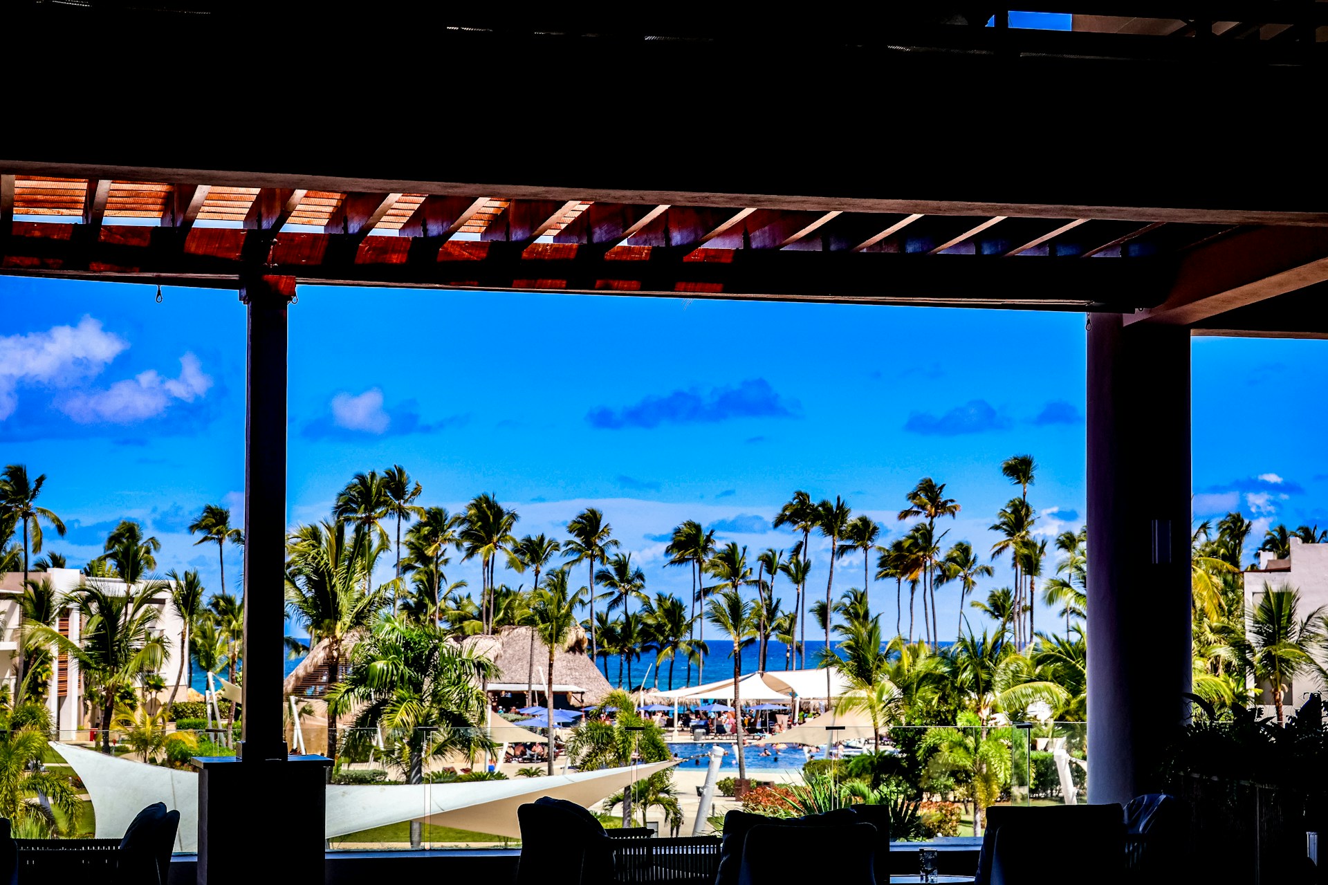 Tropical view from a covered outdoor seating.