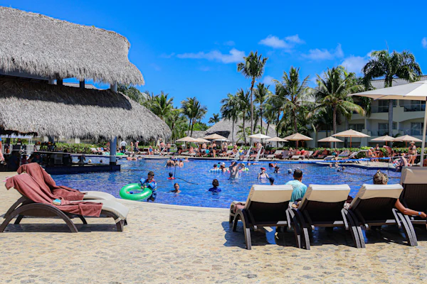 Guests relaxing at a resort pool