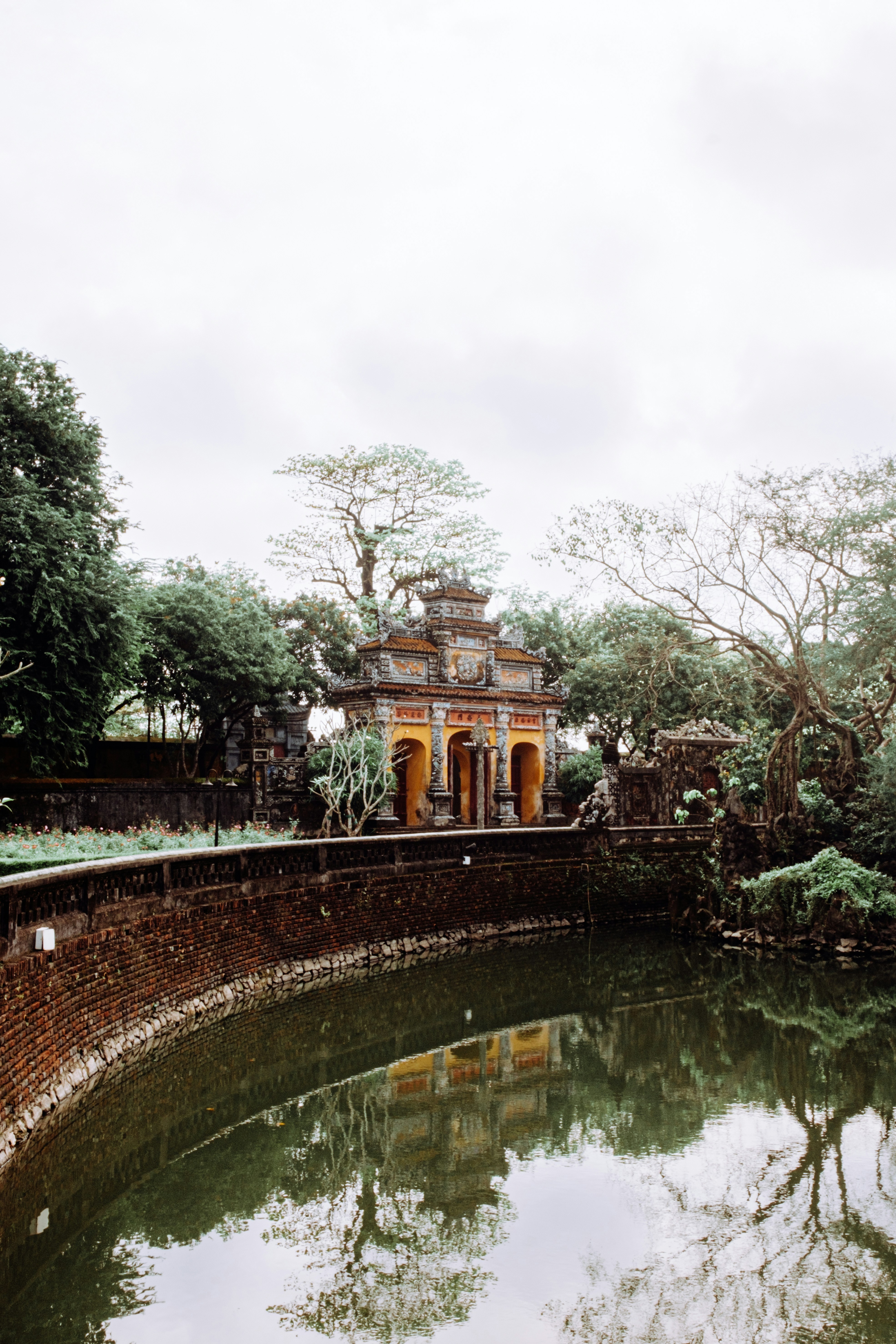 Ancient temple reflected in calm water.
