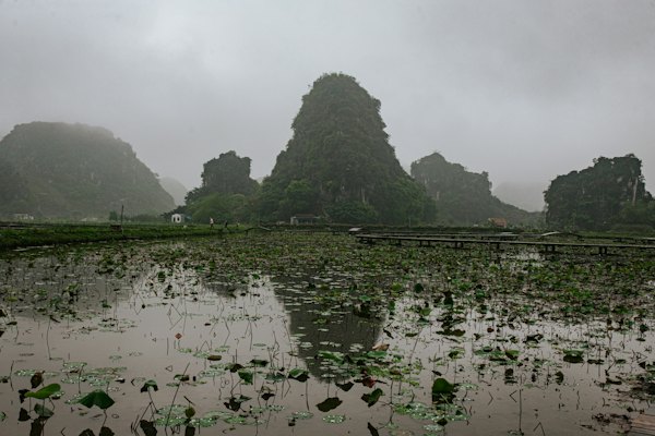 Misty mountains and a reflecting lake — Ninh Bình, Vietnam