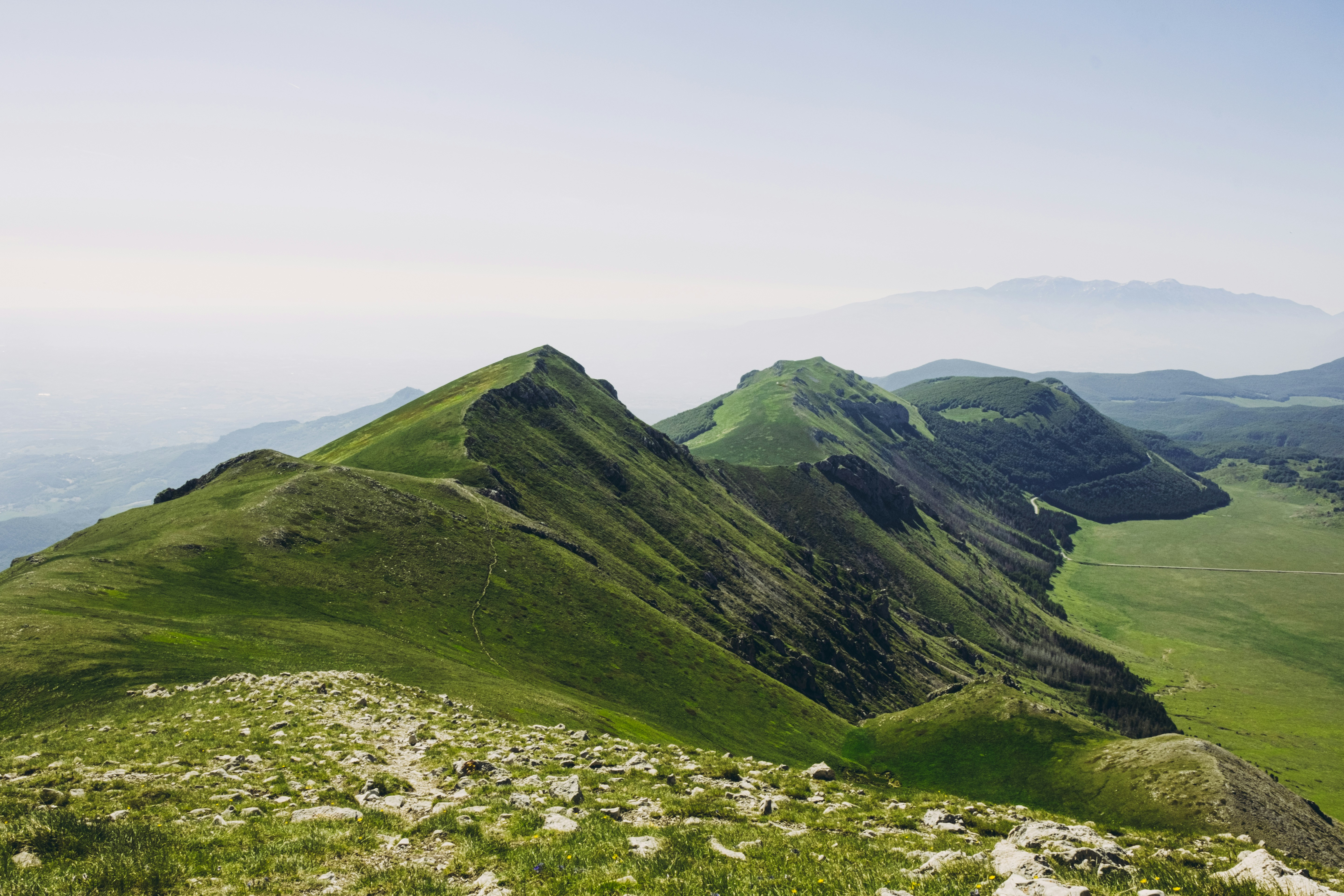 Green mountain ridges rise against the horizon.