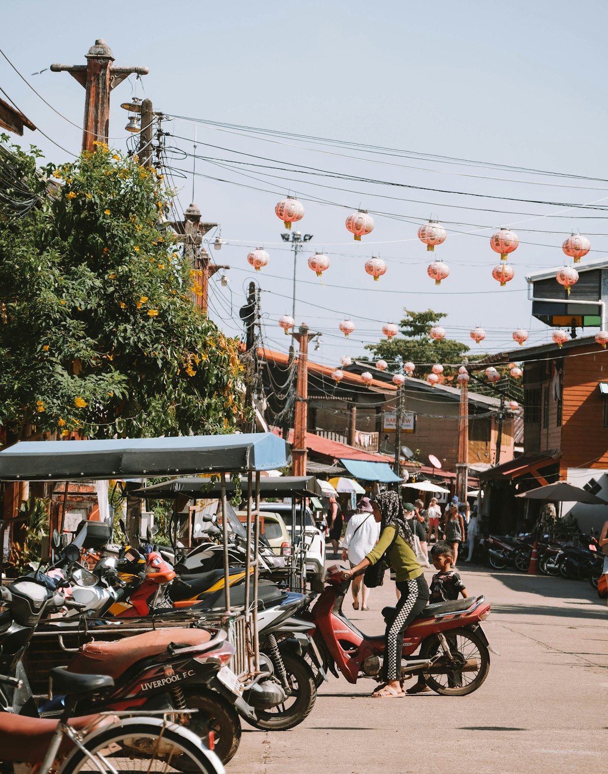 Lanta Old Town Koh Lanta — busy street with motorcycles and lanterns in Ko Lanta Yai old town
