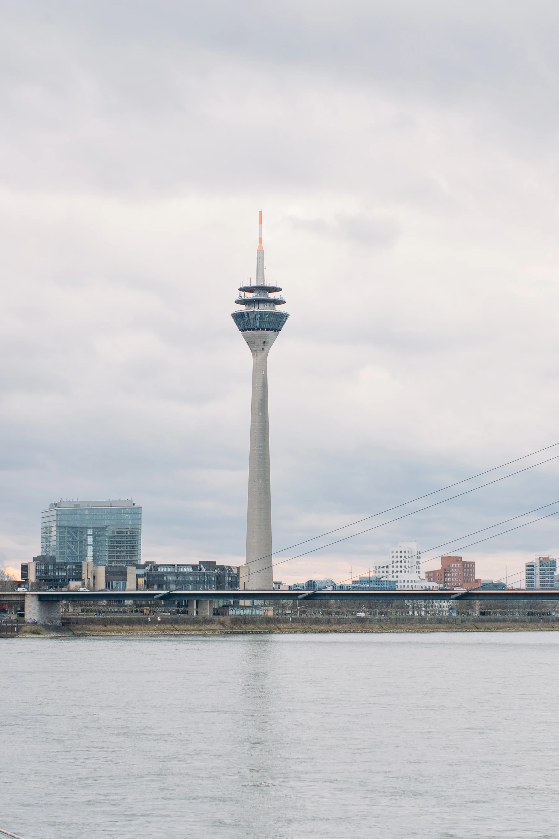 Düsseldorf's Rheinturm rising above the Rhine waterfront