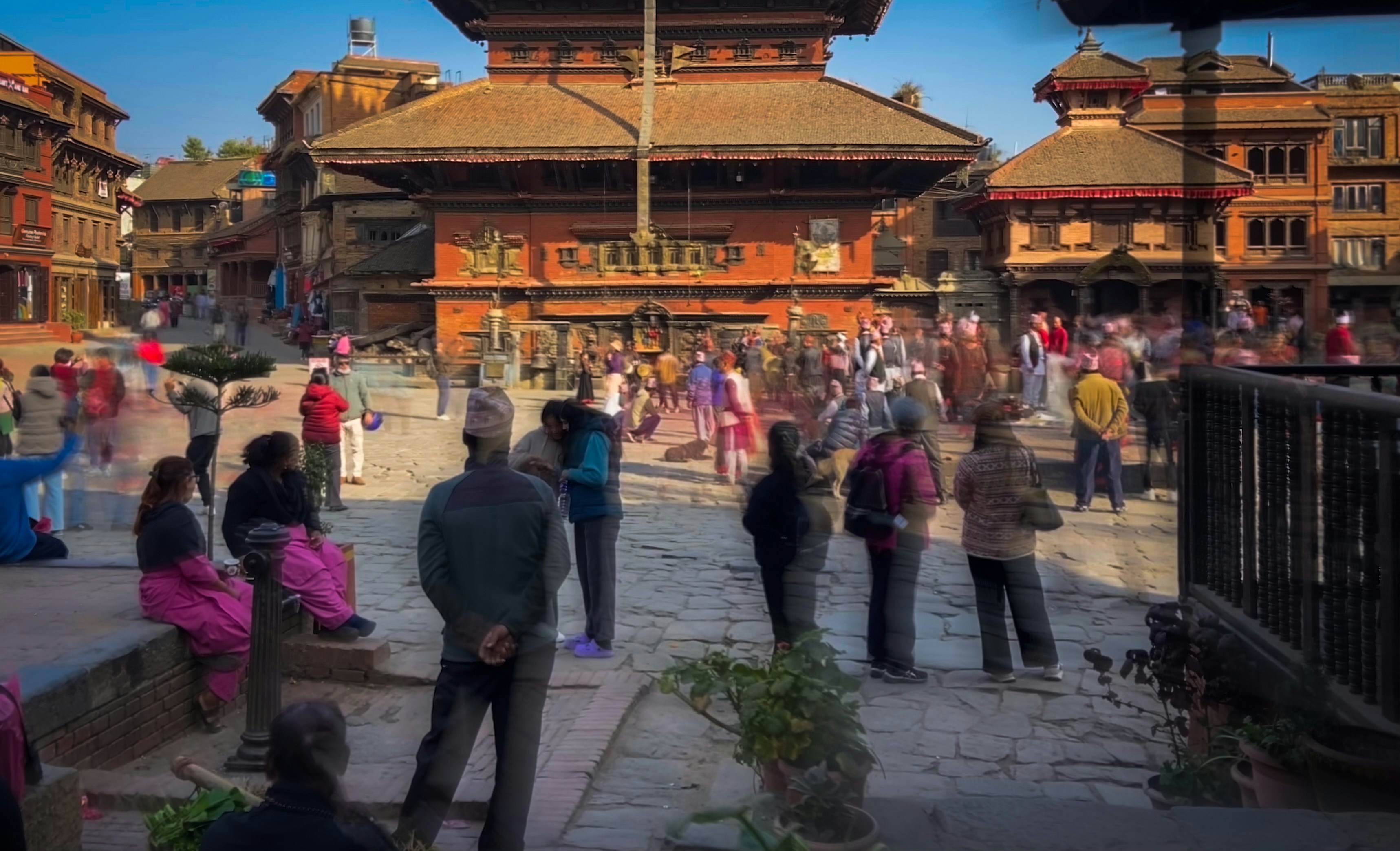 Crowds in Bhaktapur Durbar Square during a cultural event in Nepal, showcasing heritage tourism and community participation