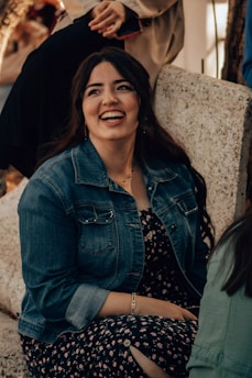 Smiling woman enjoys a sunny day with friends.