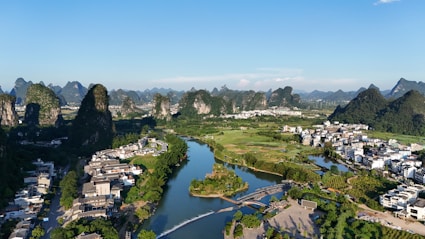 Scenic view of a river valley with limestone mountains.
