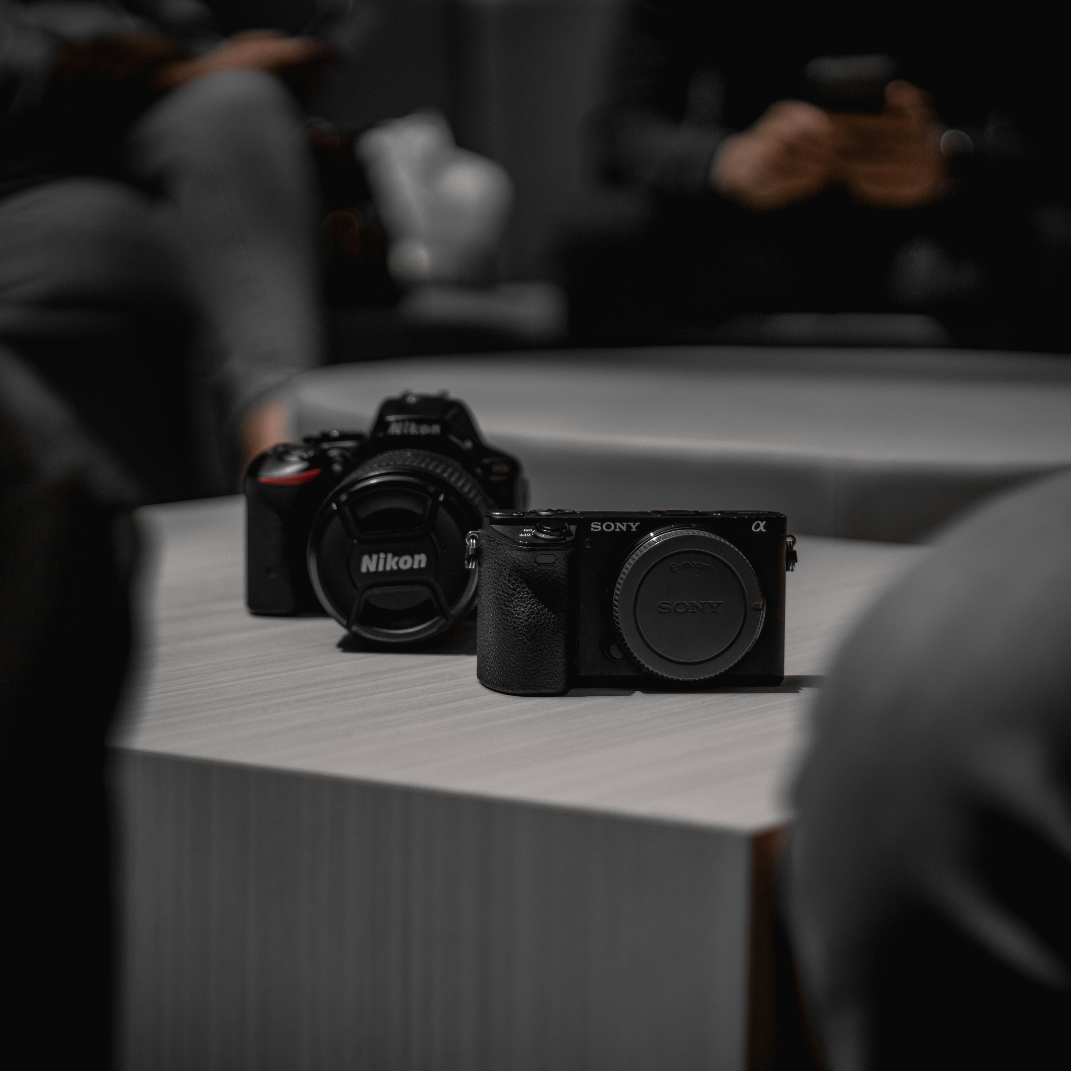 Cameras sit on a table.