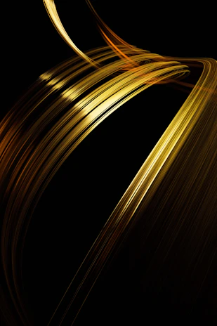 Golden light streaks against a black background.