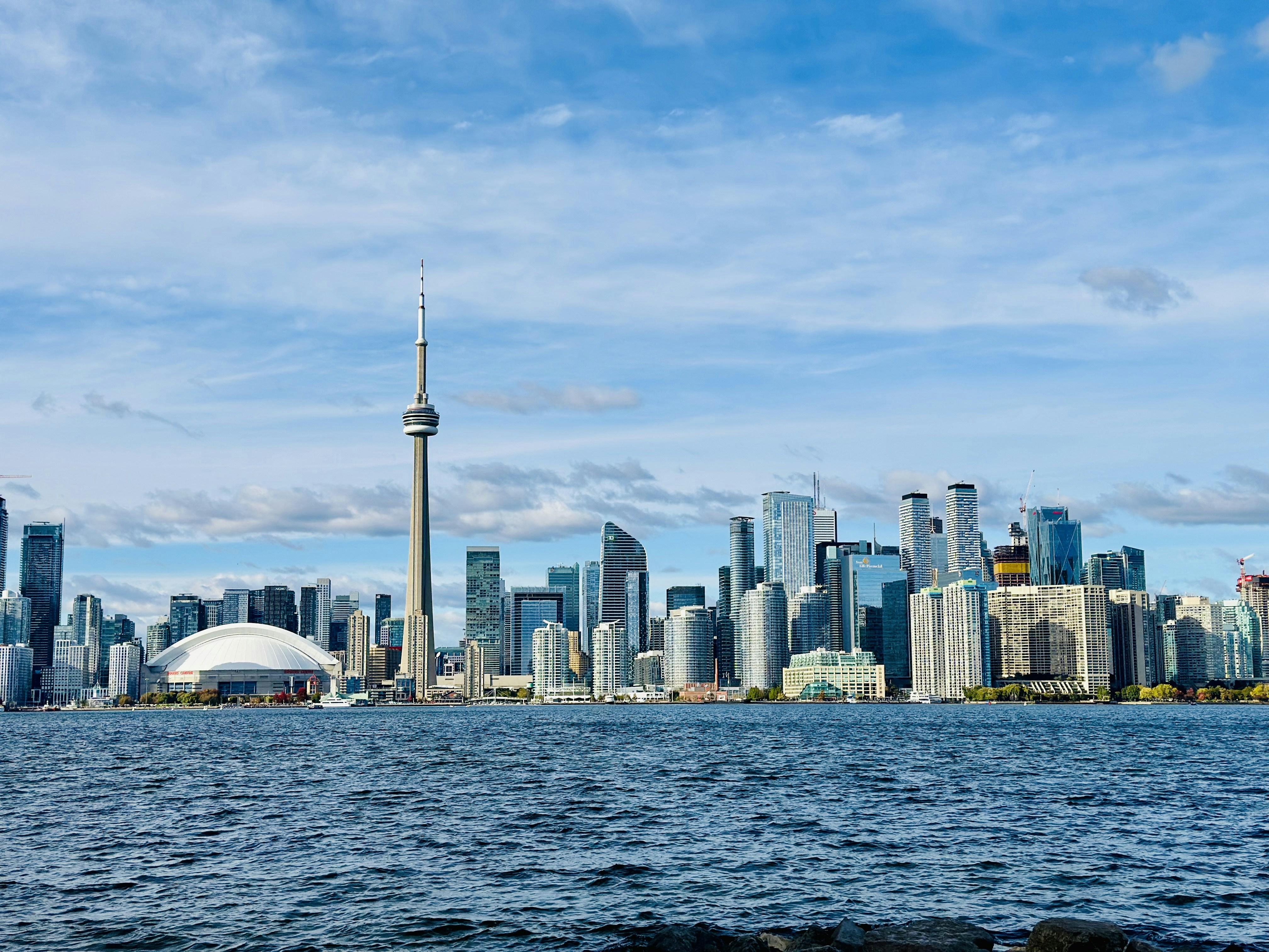 Toronto's iconic skyline is visible from the water.