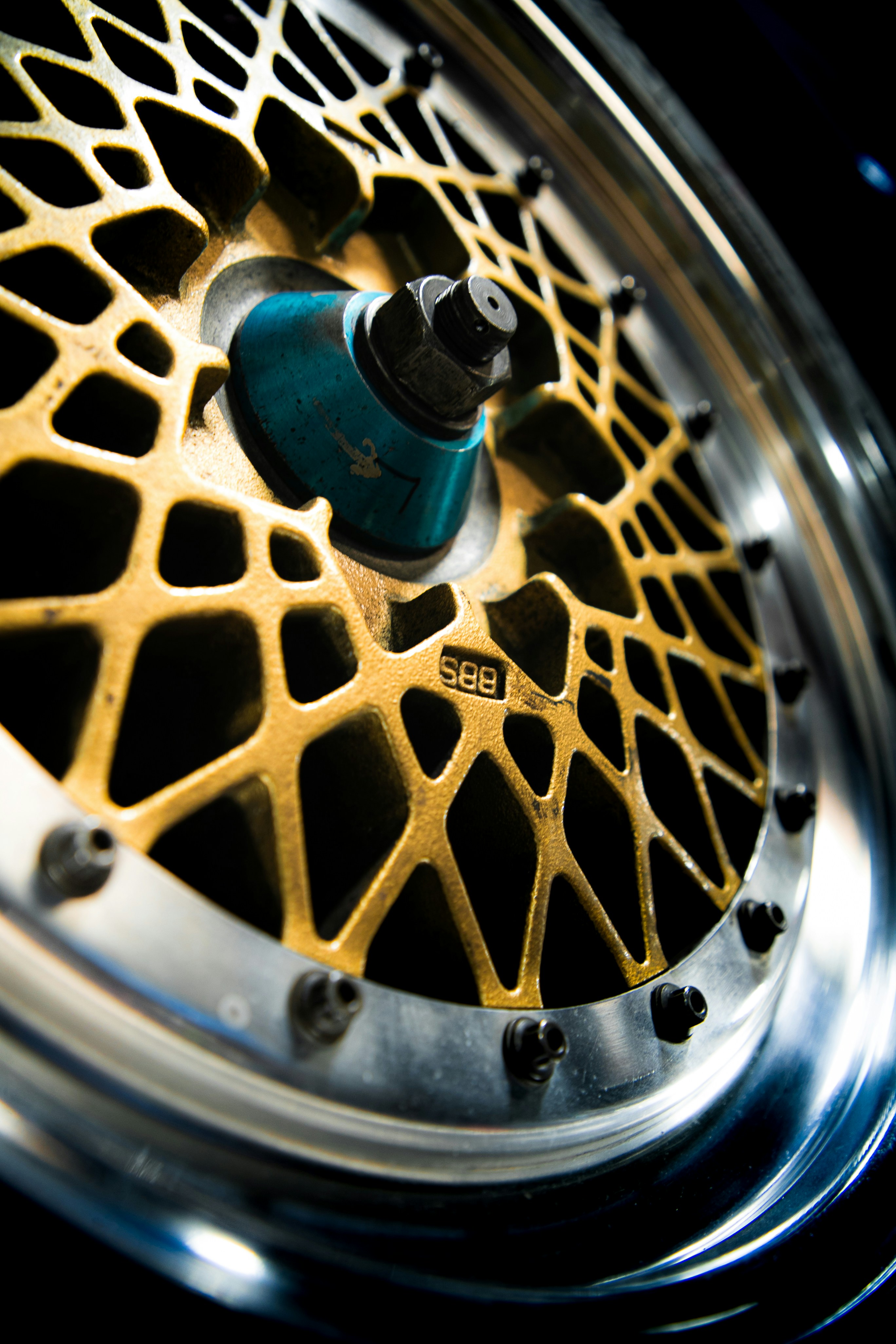 A close-up shot of a gold alloy wheel.
