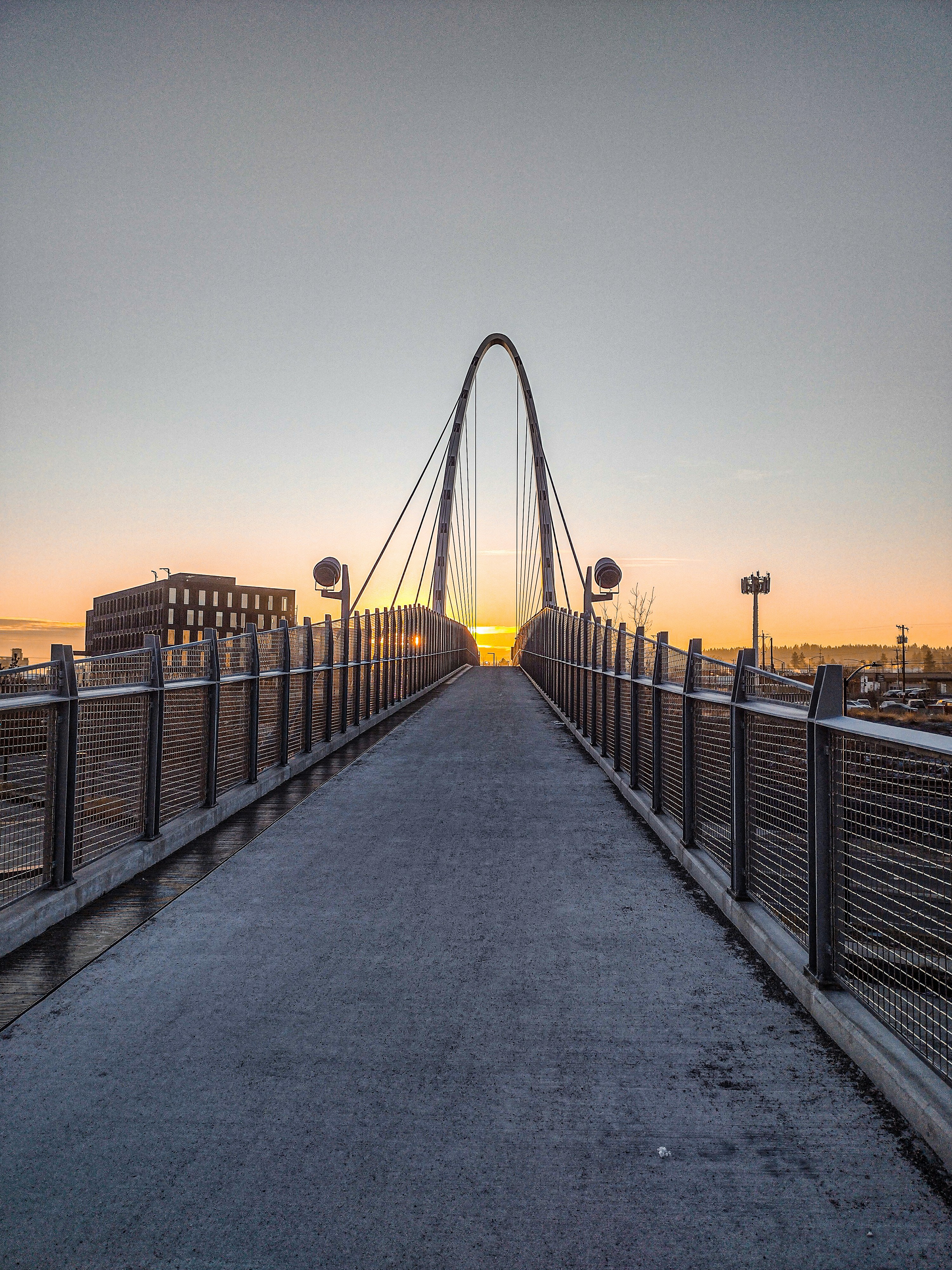 A bridge leads to the sunset during sunrise. photo – Free City Image on ...