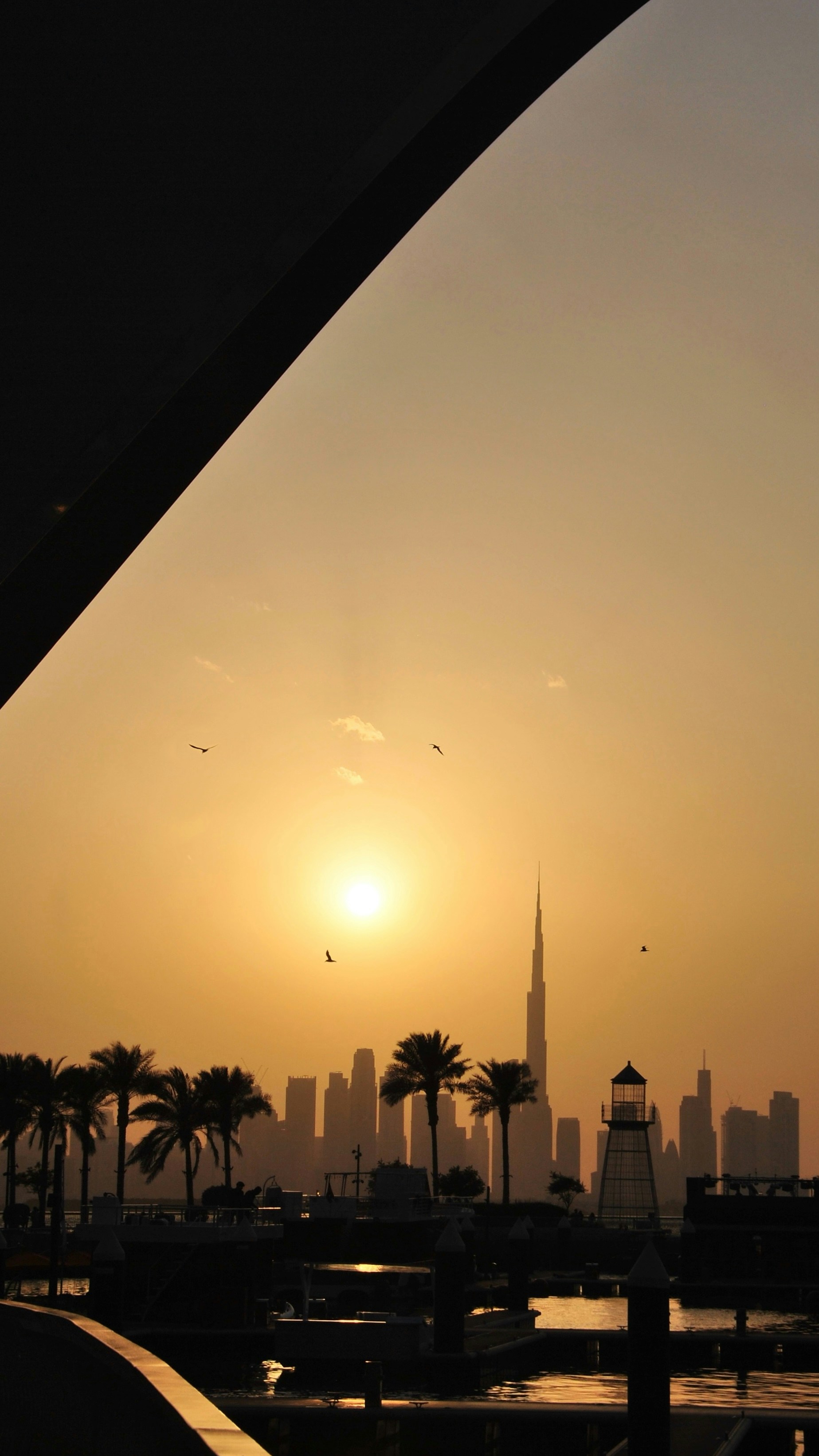 Sunset over the dubai skyline.