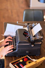 Someone is typing on a vintage typewriter
