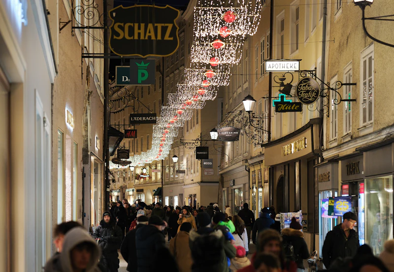 A Salzburg street strung with festive Christmas lights