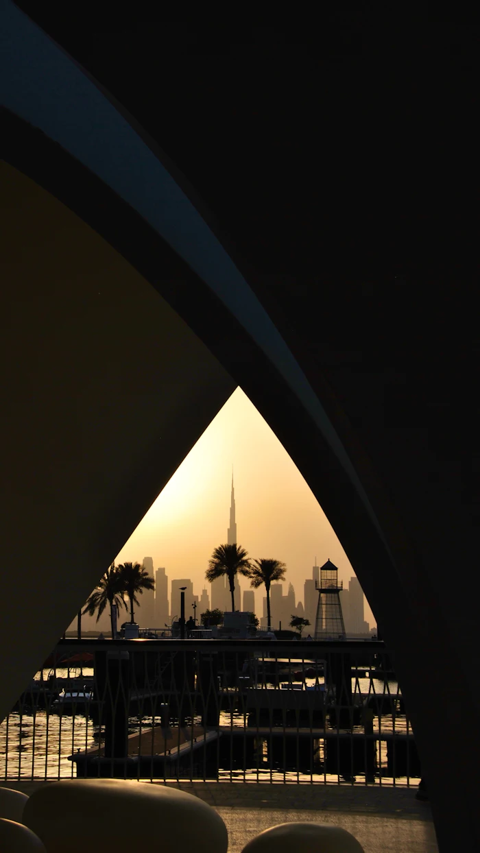 Dubai skyline framed by a traditional archway