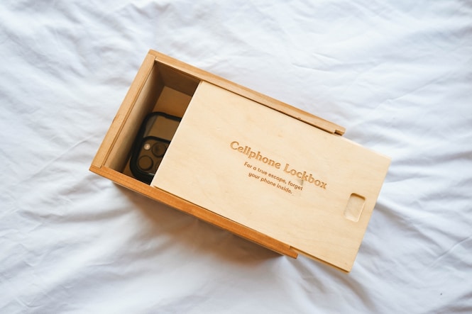 A cellphone lockbox with a phone inside is shown.