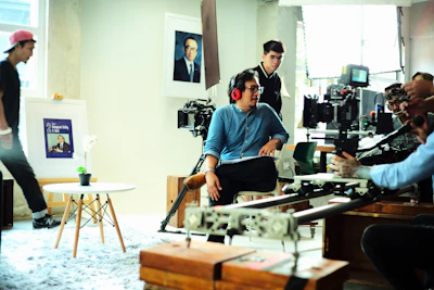 A film crew filming a scene indoors.