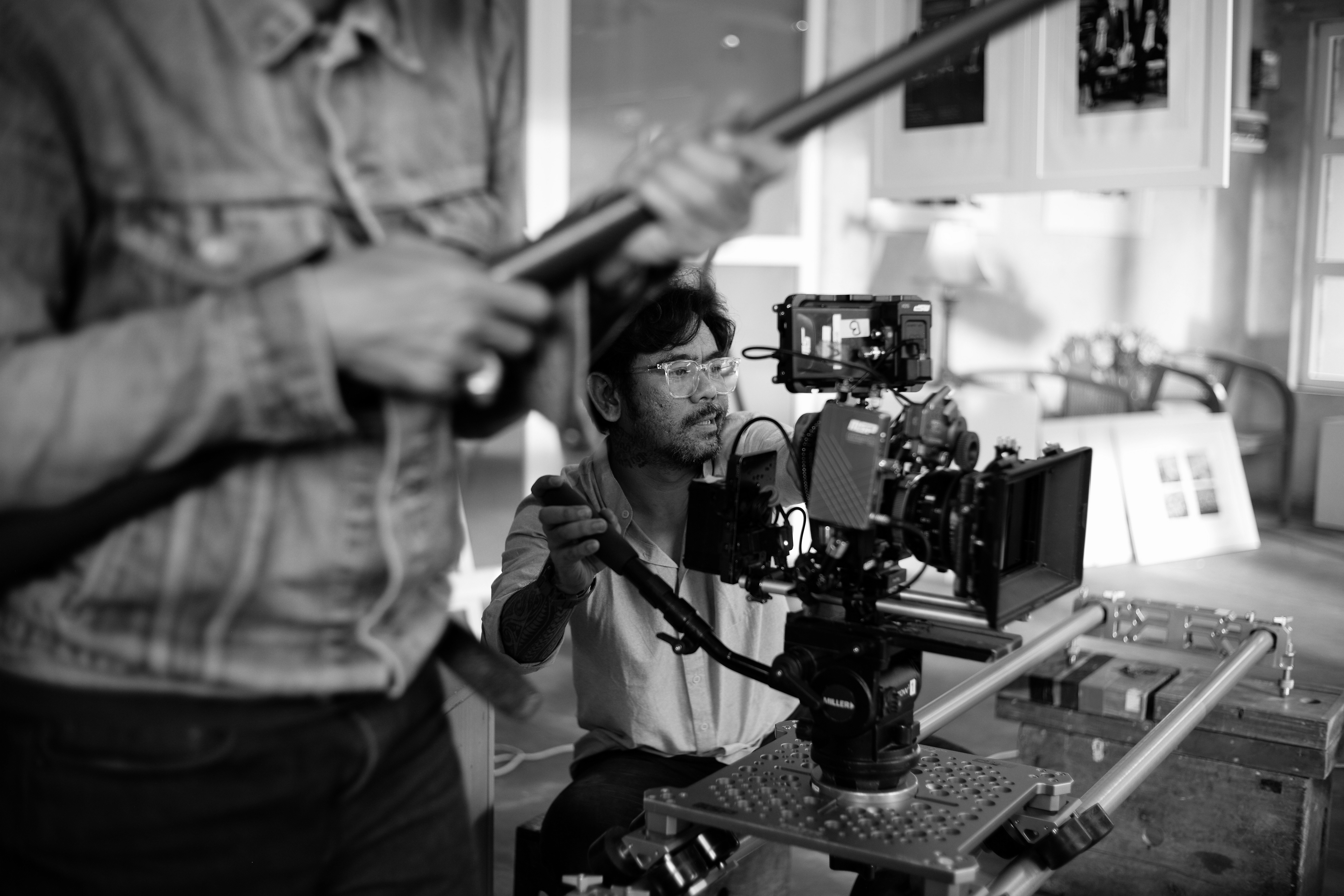 Filmmakers are using professional camera equipment.