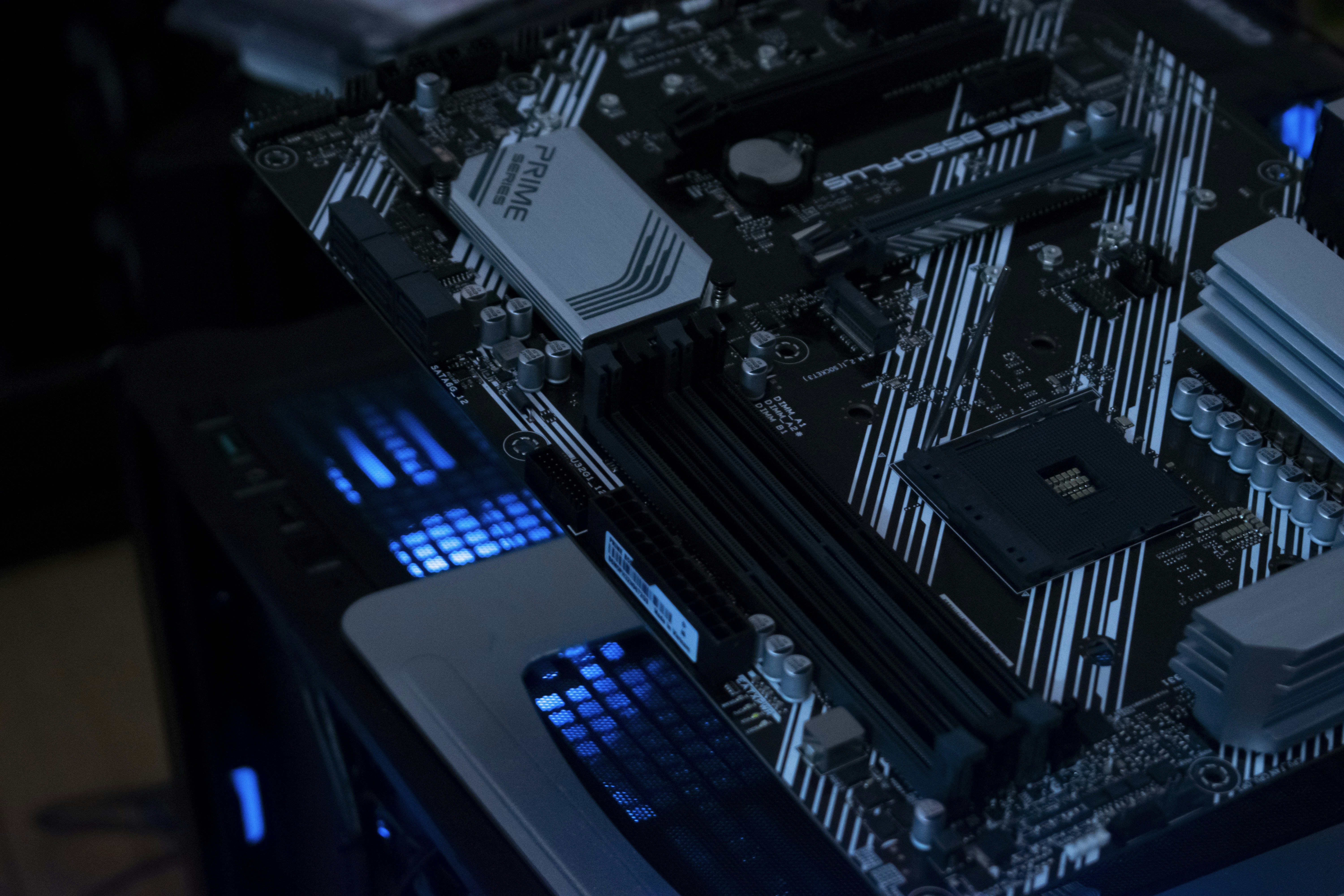A computer motherboard with glowing blue lights.
