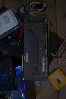 Gigabyte graphics card on a messy surface.