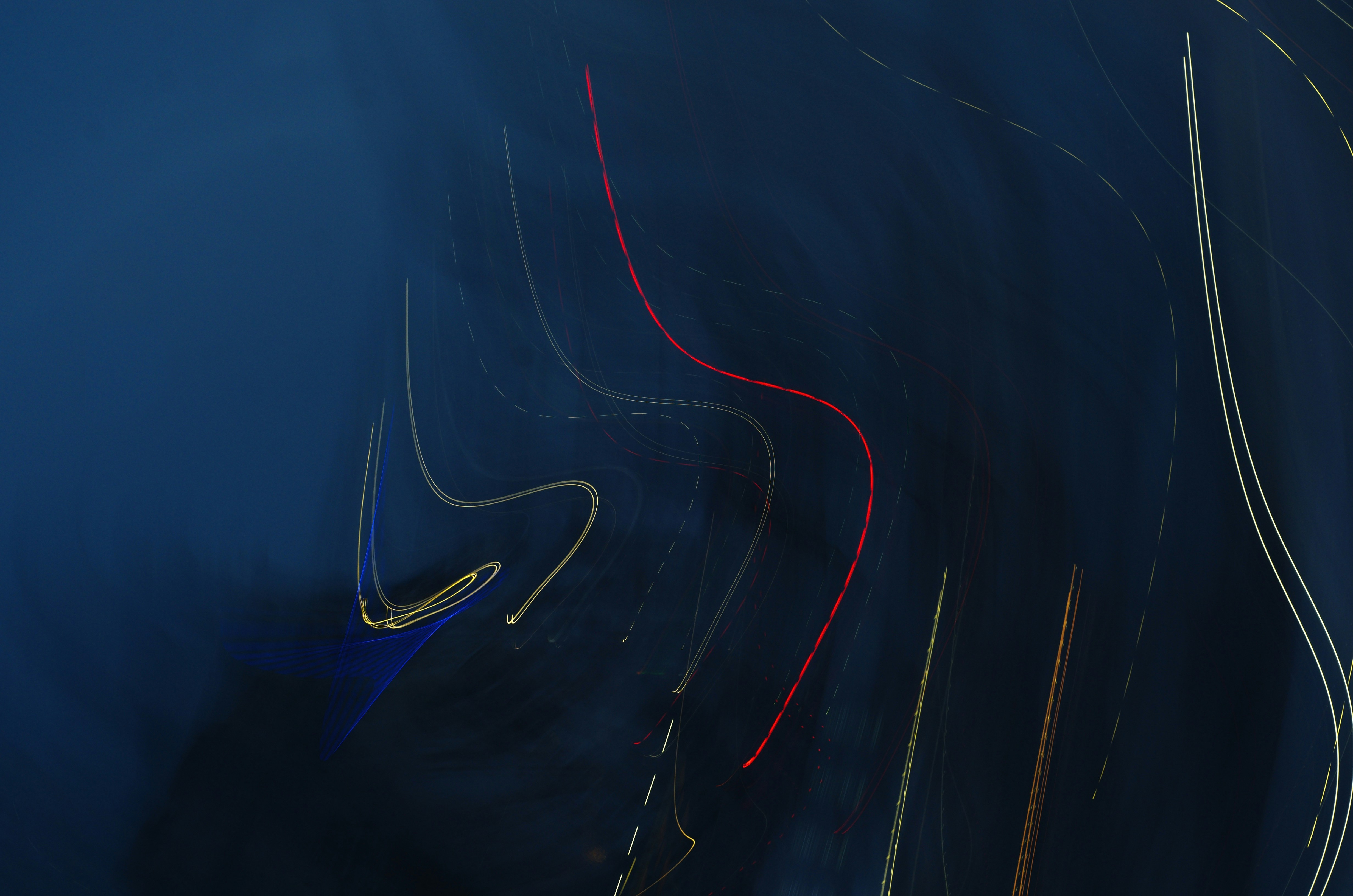 Electric vehicle driving down a highway, illustrating real-world range and performance from its motor and battery