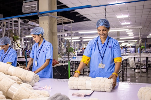 Factory workers are preparing textile products.