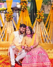 A happy couple celebrates a vibrant, flower-filled ceremony.