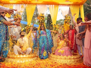 People celebrate with flowers at a traditional wedding.