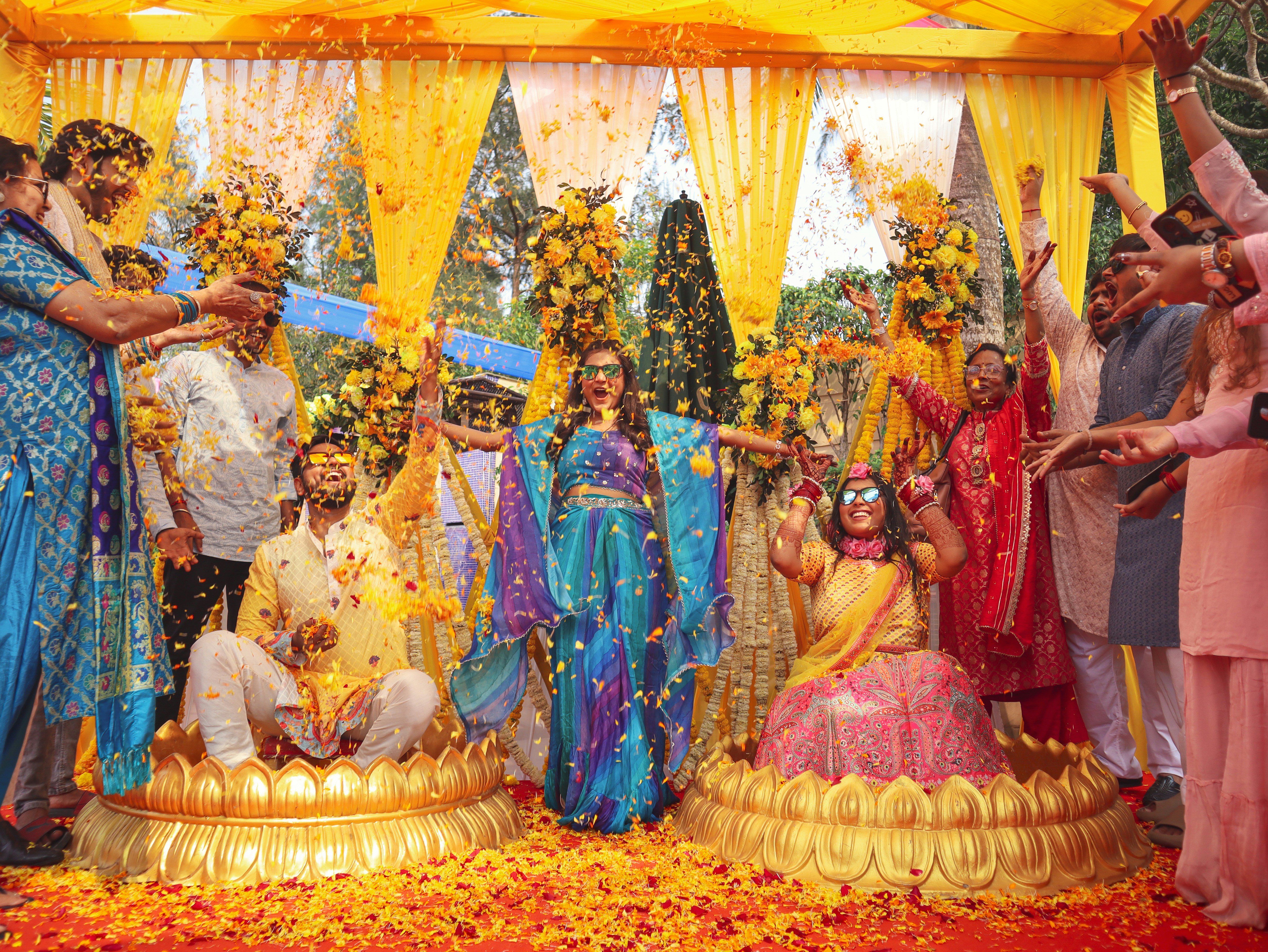 People celebrate a happy occasion with flower petals.