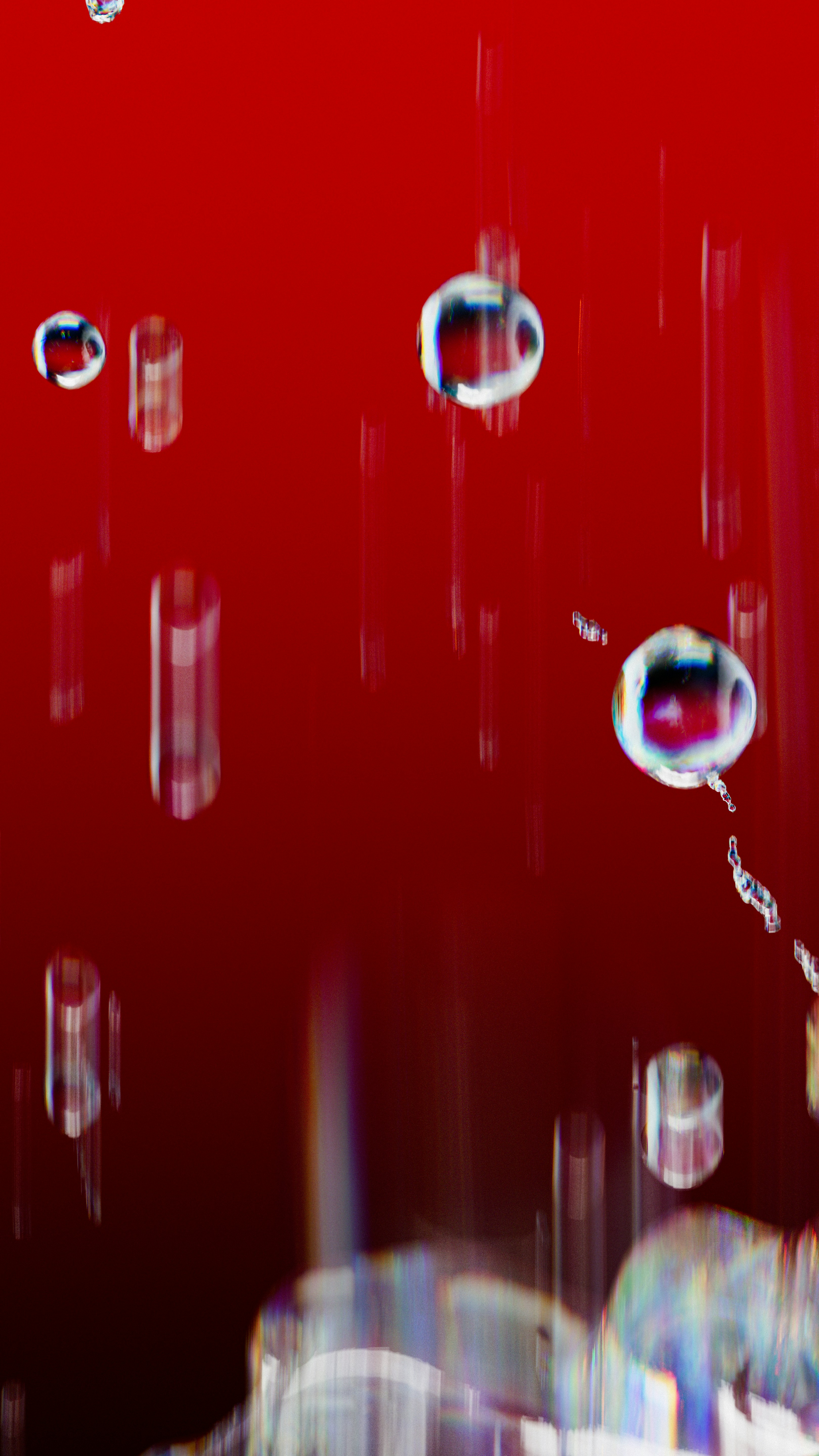 Bubbles floating on a red background.