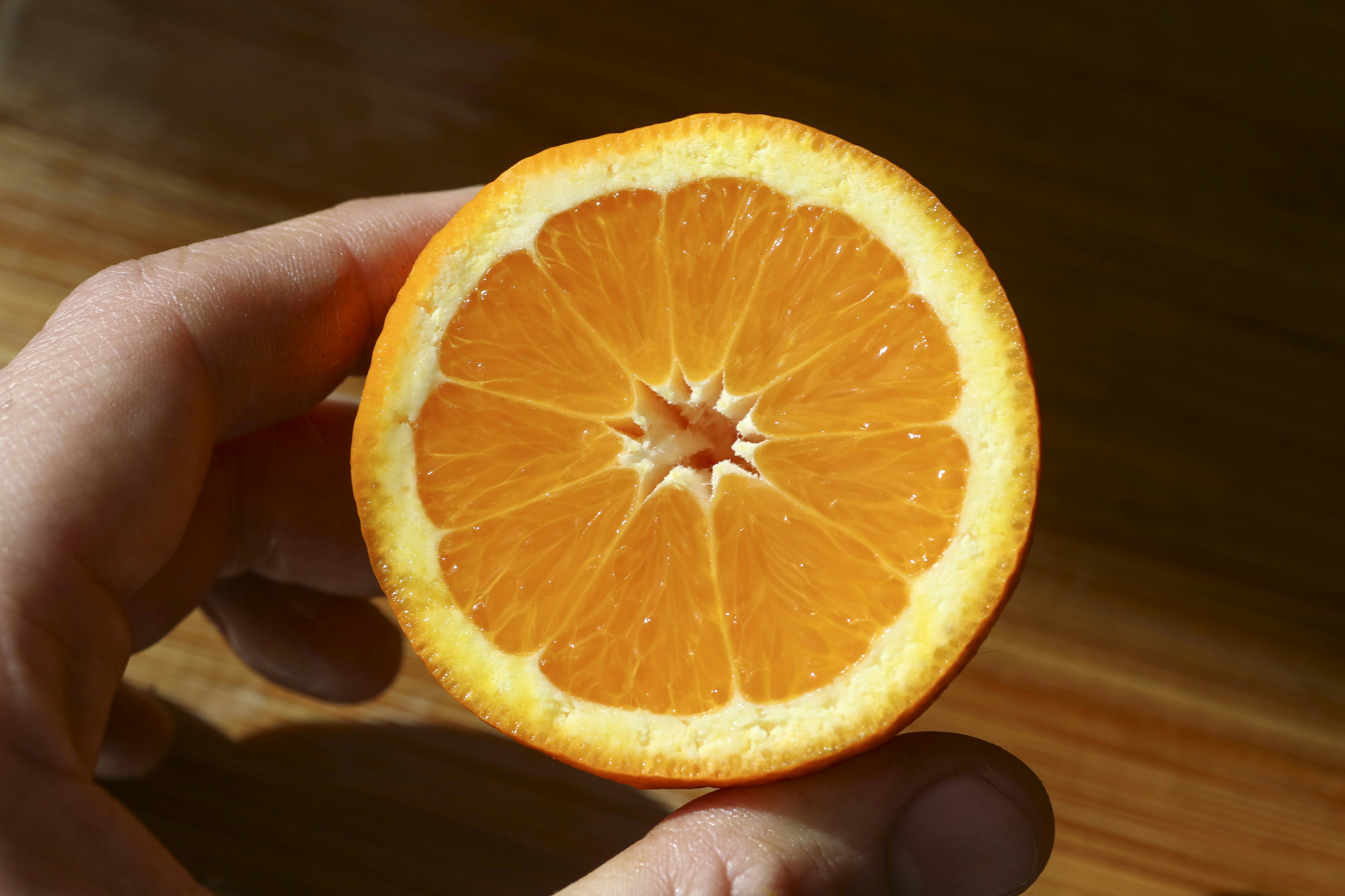 A clear plastic bottle with water on a tiled floor.
