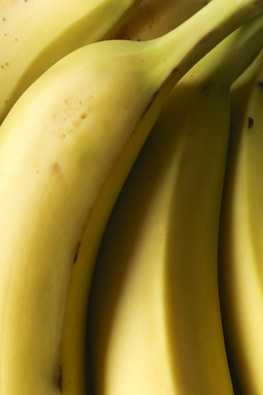 Here is a possible caption: bunch of bananas, close up view.