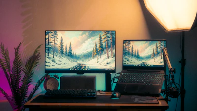A modern desk setup with two screens.