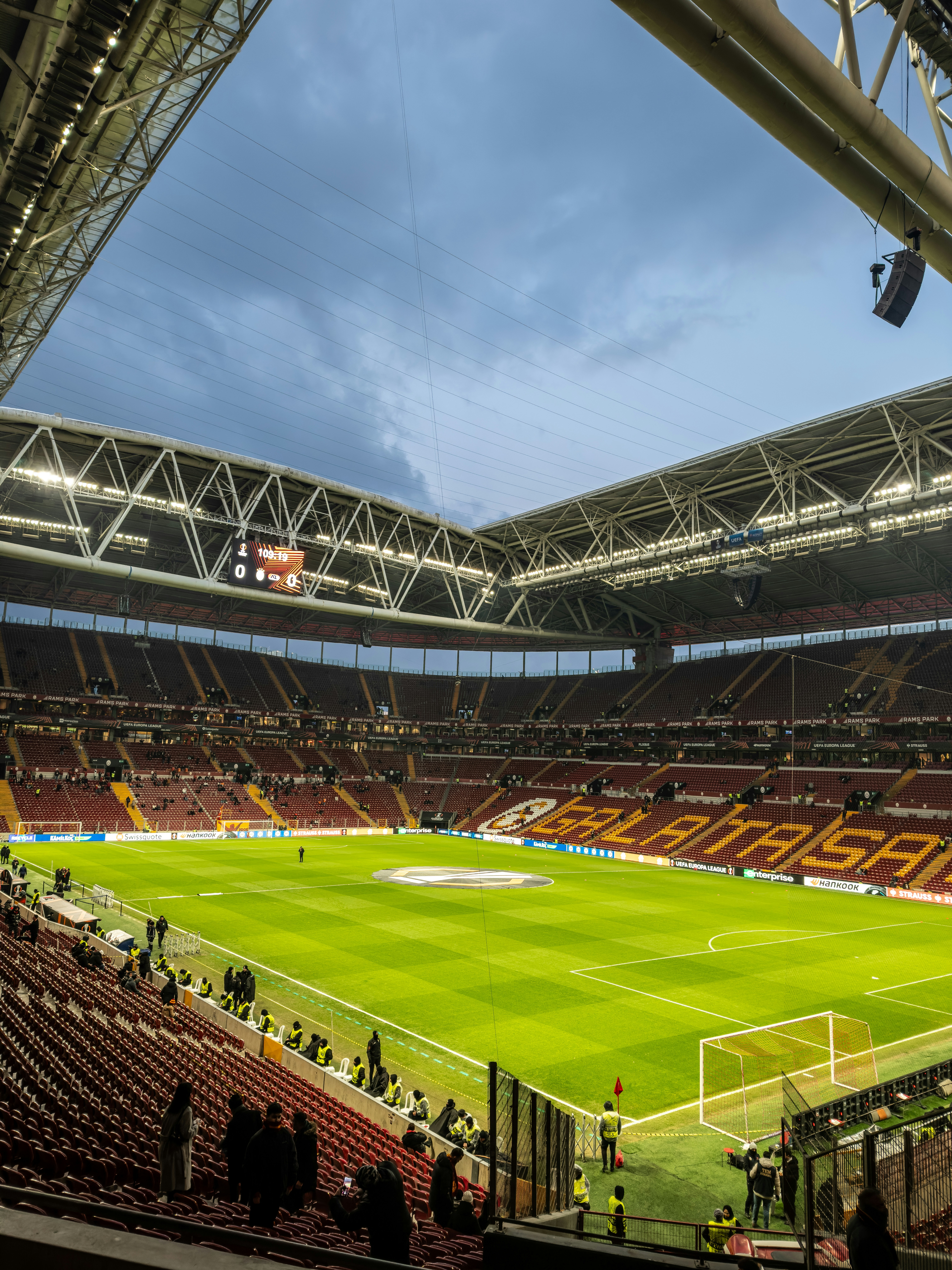 A soccer stadium is lit and ready for a game.