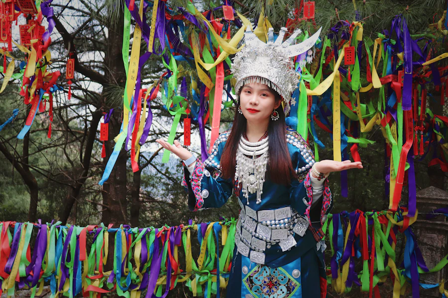 Model in a colourful hand-finished garment