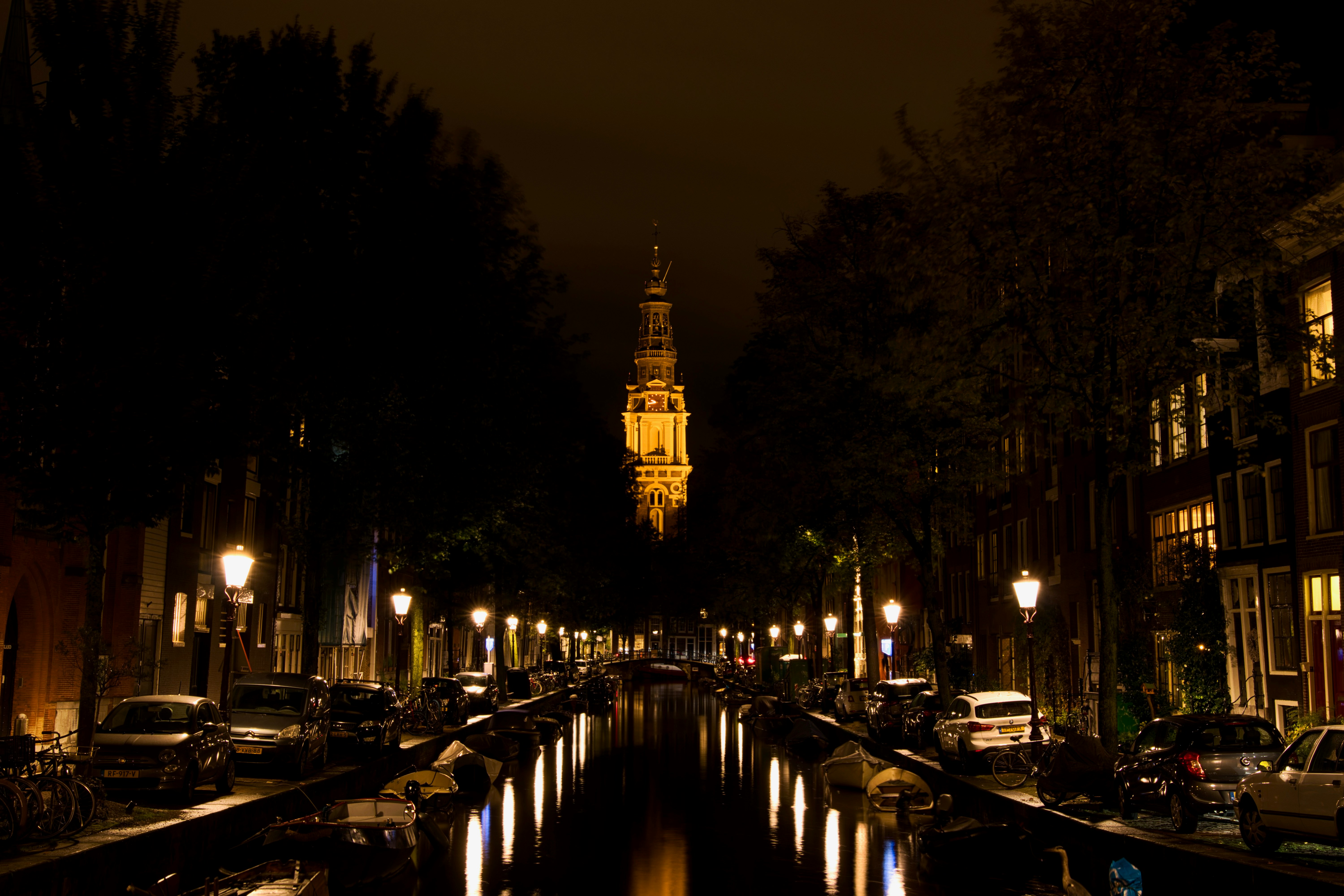 Canal at night with lit buildings.
