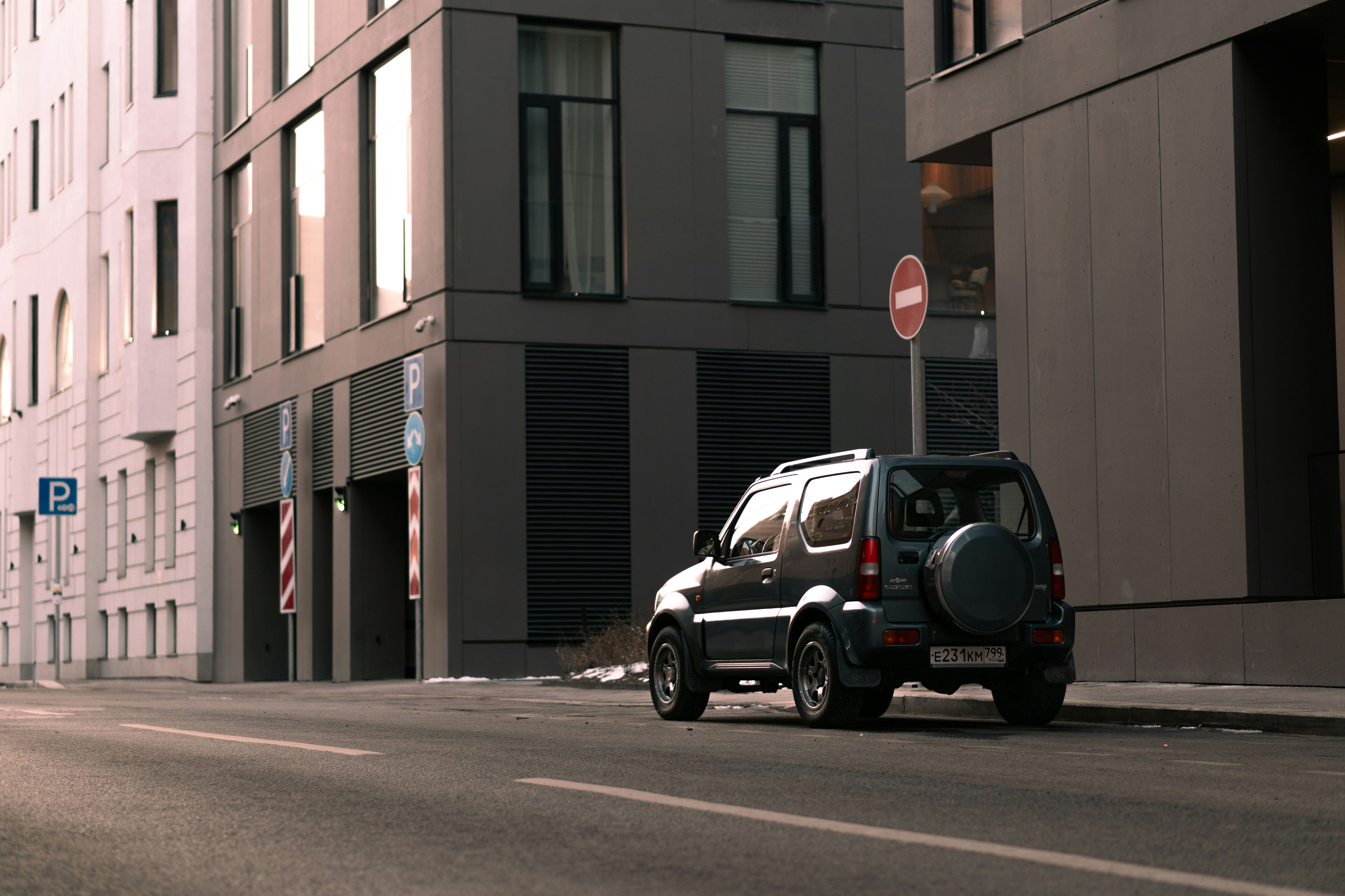 Electric SUV driving through a city, focusing on wheels and tires in motion