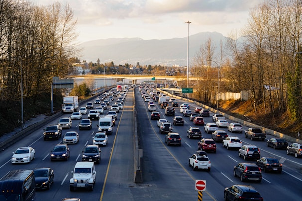 Highway is experiencing heavy traffic with many cars.
